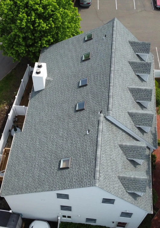aerial view of a newly serviced house with skylight and flashed chimney